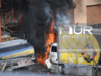 A box truck is catching fire at a warehouse on Marshall Street in Paterson, New Jersey, United States, on January 22, 2024. Authorities are...