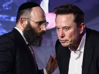 Elon Musk, owner of Tesla and the X (formerly Twitter) platform and EJA Chairman Rabbi Menachem Margolin attend a symposium on fighting anti...