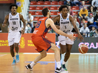 Raymond Cowels, Egehan Arna, and Christian Vital are playing during the FIBA Europe Cup match between Legia Warszawa and Bahcesehir College...