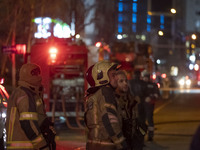 Firefighters are at the site of the fire at the Gandhi hotel hospital in northern Tehran, Iran, on January 25, 2024. They are safely evacuat...