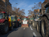Farmers from all over Catalonia are protesting for the second consecutive day in Barcelona, Spain, on February 7, 2024, blocking the streets...