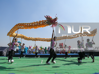 Chinese artists are performing a dragon dance to celebrate Chinese New Year at a cultural fair in Tundikhel, Kathmandu, on February 12, 2024...
