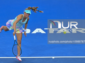 Magdalena Frech of Poland is in action during her first-round match against Victoria Azarenka of Belarus at the WTA 1000-Qatar TotalEnergies...