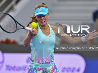 Magdalena Frech of Poland is in action during her first-round match against Victoria Azarenka of Belarus at the WTA 1000-Qatar TotalEnergies...