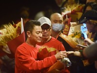 Hong Kong actor Andy Lau is signing autographs for fans during a roadshow promotion for his new film ''The Movie Emperor'' at a cinema in Ha...