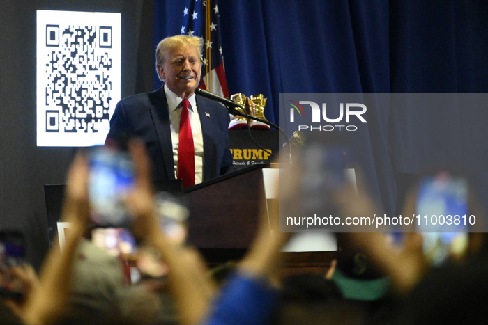 Former U.S. President Donald Trump is speaking on stage to promote self-branded golden sneakers during an appearance at SneakerCon at the Pe...
