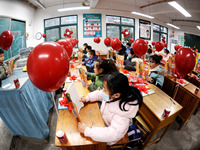 Students are waiting to receive new textbooks in a classroom of the second grade at Yuanqian Primary School in Lianyungang, China, on Februa...
