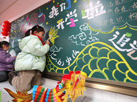 Students are preparing for the first lesson in a classroom at Yuanqian Primary School in Lianyungang, China, on February 20, 2024. (