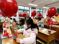 Students are reading new textbooks they have just received in a classroom of the second grade at Yuanqian Primary School in Lianyungang, Chi...