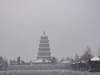Tourists are braving the snow to visit the Grand Tang Dynasty Everbright City scenic spot in Xi'an, Shaanxi Province, China, on February 23,...