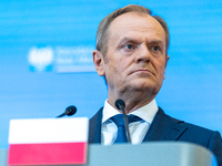 Polish Prime Minister Donald Tusk is speaking during a press conference after his meeting with Belgian Prime Minister Alexander De Croo and...