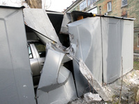 A car is sitting in a damaged garage near a block of flats that was hit by a Russian Shahed drone during an overnight attack in Dnipro, Ukra...
