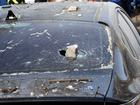 A car is sustaining damage near a block of flats that a Russian Shahed drone is hitting during an overnight attack in Dnipro, Ukraine, on Fe...