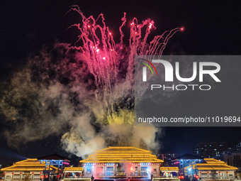 A large-scale fireworks show is being held at the Tanguo Ancient City scenic spot in Linyi, Shandong Province, China, on the evening of Febr...