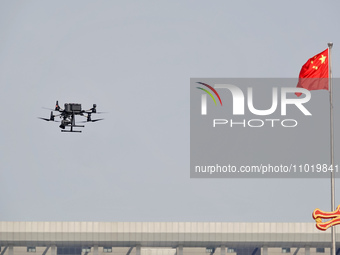 A DJI police drone is patrolling over the city in Yantai, East China's Shandong province, on February 23, 2024. (