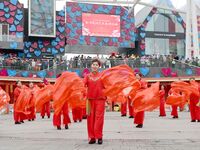 Citizens are taking part in a folk art performance during the Lantern Festival at the Maritime Carnival Square in the West Coast New Area of...