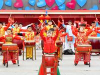 Citizens are taking part in a folk art performance during the Lantern Festival at the Maritime Carnival Square in the West Coast New Area of...