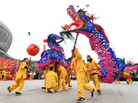 Folk artists are performing a dragon lantern dance in Quzhou County, Handan City, Hebei Province, North China, on February 24, 2024. (