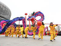Folk artists are performing a dragon lantern dance in Quzhou County, Handan City, Hebei Province, North China, on February 24, 2024. (