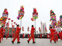 Folk artists are performing with an array of reed lanterns in Handan, North China's Hebei province, on February 24, 2024. (