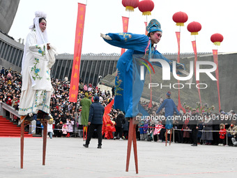 Folk artists are performing on stilts in Handan, China, on February 24, 2024. (