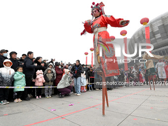 Folk artists are performing on stilts in Handan, China, on February 24, 2024. (