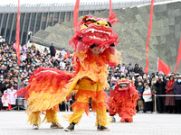 Folk artists are performing a lion dance in Handan, North China's Hebei province, on February 24, 2024. (