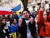 Ukrainian citizens and supporters attend the march ' Together For Victory ' in front of the Russian Consulate General to show solidarity wit...