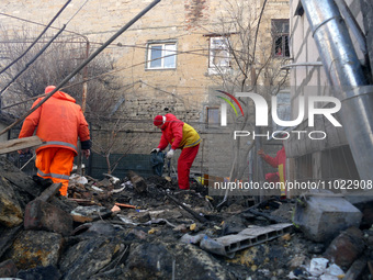 Municipal workers are removing the rubble after the Russian overnight drone attack in Odesa, Ukraine, on February 24, 2024. (