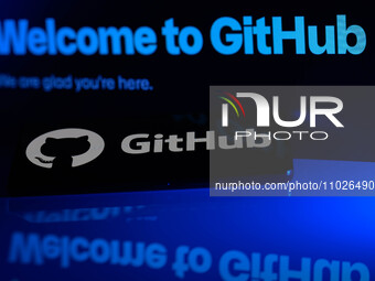 The GitHub logo is being displayed on a smartphone with the GitHub web home screen visible in the background in this photo illustration, in...