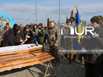 People are paying their last respects to a serviceman, Roman Kornuta (call sign ''Mazepa''), who died in the war with Russia, during a funer...