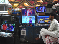 A person is selling second-hand LCD TV sets inside a second-hand electronics market in Kolkata, India, on February 26, 2024. (