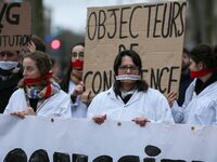 Protestors are taking part in a silent pro-life demonstration in Paris, France, on February 28, 2024, with cloths covering their mouths as t...