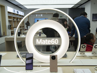 Customers are buying electronic products at a Huawei store in Haian, China, on February 24, 2024. (