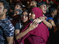 People are searching for their loved ones after a fire erupted in a multi-storey building in Dhaka, Bangladesh, on February 29, 2024. At lea...