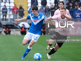 Dimitri Bisoli of Brescia Calcio FC is being followed by Kristoffer Lund during the Italian Serie B soccer championship match between Bresci...