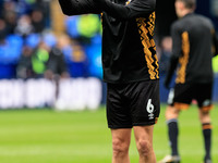 Ryan Bennett #6 of Cambridge United is warming up before the match during the Sky Bet League 1 match between Bolton Wanderers and Cambridge...