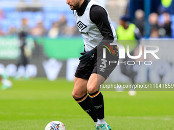 Danny Andrew #3 of Cambridge United is warming up before the match during the Sky Bet League 1 match between Bolton Wanderers and Cambridge...