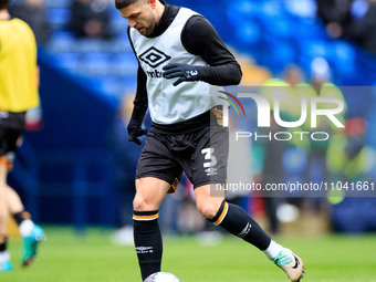 Danny Andrew #3 of Cambridge United is warming up before the match during the Sky Bet League 1 match between Bolton Wanderers and Cambridge...