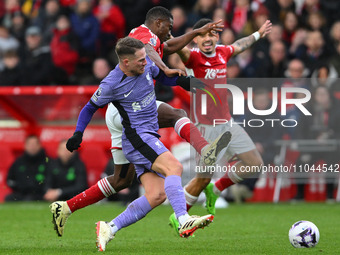 Alexis Mac Allister of Liverpool is battling with Taiwo Awoniyi of Nottingham Forest during the Premier League match between Nottingham Fore...