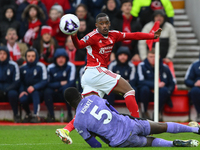 Callum Hudson-Odoi of Nottingham Forest is crossing the ball under pressure from Ibrahima Konate of Liverpool during the Premier League matc...