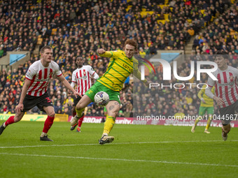 Josh Sargent of Norwich City is scoring to make it 1-0, with Luke O'Nien of Sunderland applying pressure during the Sky Bet Championship mat...
