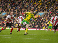 Josh Sargent of Norwich City is scoring to make it 1-0, with Luke O'Nien of Sunderland applying pressure during the Sky Bet Championship mat...