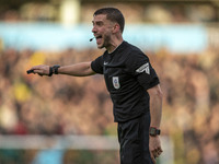 Referee Thomas Kirk is giving instructions to players during the Sky Bet Championship match between Norwich City and Sunderland at Carrow Ro...