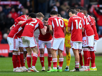 The Nottingham Forest players are huddling ahead of the second half kickoff during the Premier League match against Liverpool at the City Gr...