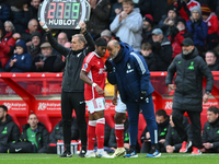 Nuno Espirito Santo, the head coach of Nottingham Forest, is giving instructions to Anthony Elanga of Nottingham Forest during the Premier L...