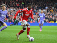 Divock Origi of Nottingham Forest is running with the ball during the Premier League match between Nottingham Forest and Liverpool at the Ci...