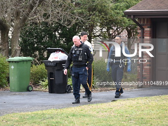 Detectives are gathering evidence at the crime scene following a stabbing at a home on Jupiter Lane in Paramus, New Jersey, United States, o...