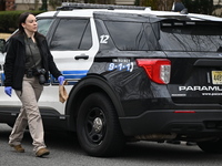 A detective is at the crime scene with a full evidence collection bag following a stabbing at a home on Jupiter Lane in Paramus, New Jersey,...