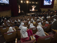 Child laborers are sitting in a concert hall before the start of a live concert at the Tehran Milad Tower Cultural and Recreational Complex...